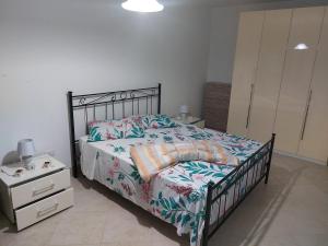 Postel nebo postele na pokoji v ubytování Taverna li Rizzi