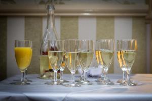 a group of wine glasses sitting on a table at The Sandringham Court Hotel & Apartment Welcoming Large and Small Groups for 15 years in Blackpool