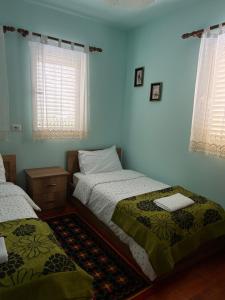 Postel nebo postele na pokoji v ubytování VITA Guesthouse