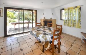 a bedroom with a bed and a fireplace at Stunning Home In Uchaux in Uchaux