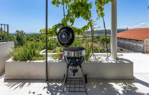 a grinding machine sitting on top of a balcony at Amazing Home In Kukuljanovo With Wifi in Kukuljanovo +20 photos