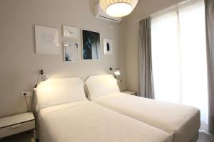 Posteľ alebo postele v izbe v ubytovaní Las Atarazanas - Design Hostal