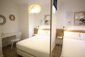 Posteľ alebo postele v izbe v ubytovaní Las Atarazanas - Design Hostal