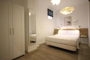 Posteľ alebo postele v izbe v ubytovaní Las Atarazanas - Design Hostal