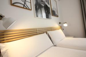 Posteľ alebo postele v izbe v ubytovaní Las Atarazanas - Design Hostal