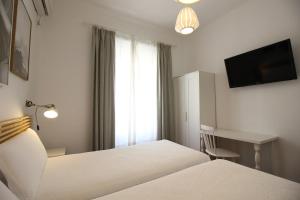 Posteľ alebo postele v izbe v ubytovaní Las Atarazanas - Design Hostal
