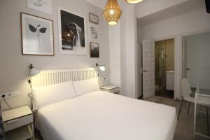 Posteľ alebo postele v izbe v ubytovaní Las Atarazanas - Design Hostal