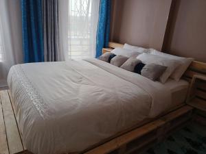 Ένα ή περισσότερα κρεβάτια σε δωμάτιο στο Talma Home
