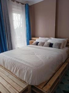 Ένα ή περισσότερα κρεβάτια σε δωμάτιο στο Talma Home