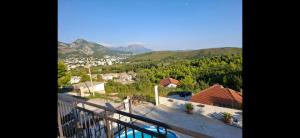 a view from the balcony of a house with mountains at Stan Milacic in Sutomore