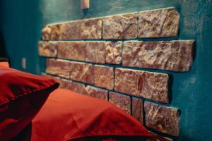 a blue wall with a brick wall at Antares Boutique Guesthouse in Benitses +28 photos