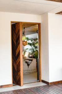 a pivot door in a house with a mirror at Casa OuirA Chalet con Piscina Privada y vistas in Corralejo +51 photos