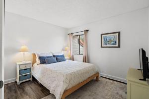 Ένα ή περισσότερα κρεβάτια σε δωμάτιο στο Holiday Island E59 +41 φωτογραφίες