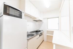 Kuchyň nebo kuchyňský kout v ubytování G新宿最中心 两室一厅 新宿三丁目车站4分 2 rooms Shinjuku center 4 mins to ST Max 7P 直达新宿 涉谷 表参道 池袋 上野 代代木 银座 原宿 品川