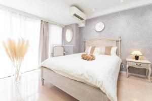 Postel nebo postele na pokoji v ubytování G新宿最中心 两室一厅 新宿三丁目车站4分 2 rooms Shinjuku center 4 mins to ST Max 7P 直达新宿 涉谷 表参道 池袋 上野 代代木 银座 原宿 品川