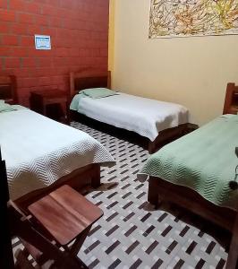 Postel nebo postele na pokoji v ubytování Casa Hotel Vida Caranavi, La Paz