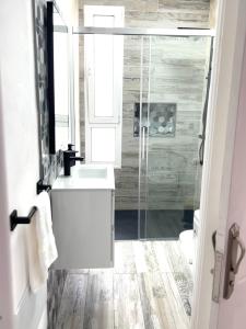 a bathroom with a sink and a glass shower at Casa Gary in Caleta de Caballo +32 photos