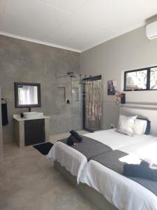 Postel nebo postele na pokoji v ubytování House Motswiri