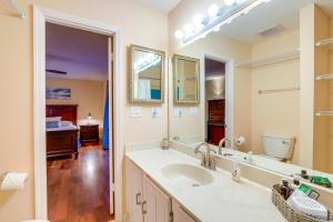 a bathroom with a sink and a mirror at Atlanta Abode with Yard in a Tranquil Setting! in Norcross +27 photos