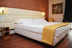 Postel nebo postele na pokoji v ubytování Hotel Delta Florence
