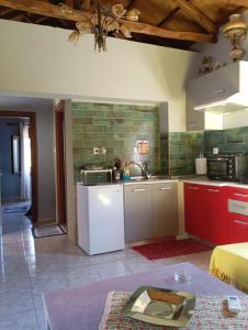 a kitchen with a sink and a counter top at Stone and Serenity Cottage in Pilion +22 photos