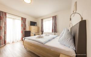 Postel nebo postele na pokoji v ubytování Restaurant - Café - Pension HASSLER