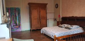 Postel nebo postele na pokoji v ubytování La Miséricorde