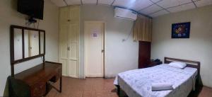 Postel nebo postele na pokoji v ubytování Hotel Andes Inn