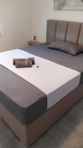 two beds in a room with avertisement at House Munich - Montenegro in Donji Štoj +18 photos