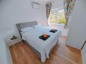 Postel nebo postele na pokoji v ubytování Apartments Alen