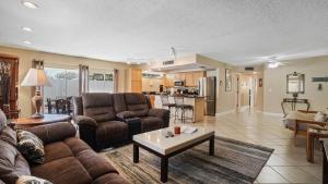 a living room with a couch and a table at Waves 1 in St Pete Beach