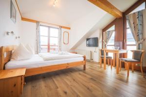 Postel nebo postele na pokoji v ubytování Restaurant - Café - Pension HASSLER