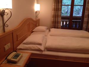 Voodi või voodid majutusasutuse Hotel Bad Winkel toas