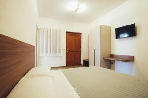 Televiisor ja/või meelelahutuskeskus majutusasutuses Tenuta Bianca Agriresort