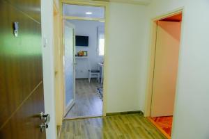 an open door to a room with a hallway at Panorama Plužine Apartment in Plužine