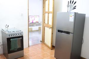 Cuisine ou kitchenette dans l'établissement Garden Suite