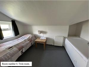 Voodi või voodid majutusasutuse Guesthouse Básar toas