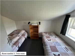 Voodi või voodid majutusasutuse Guesthouse Básar toas