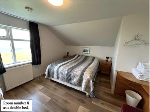 Voodi või voodid majutusasutuse Guesthouse Básar toas