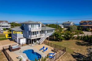 an aerial view of a house with a swimming pool at SH125 Here & Now in Southern Shores