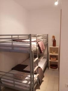a bunk bed room with two bunk beds at Glifa Beach House Maisonette in Glida