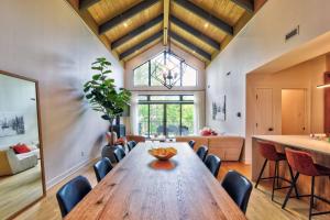 a large dining room with a wooden table and chairs at Verbier C - Mont-Tremblant Pool Spa and Gym in Mont-Tremblant