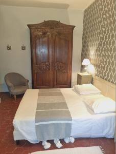 Postel nebo postele na pokoji v ubytování Château des Charmes