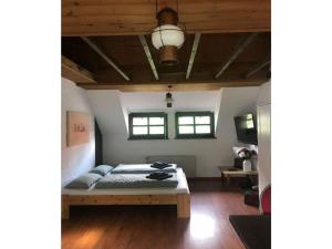 a bedroom with a bed and a wooden ceiling at Apartment in the Schildesch town center in Bielefeld