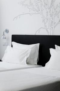 Cama ou camas em um quarto em Open Village Sports Hotel & Spa Club