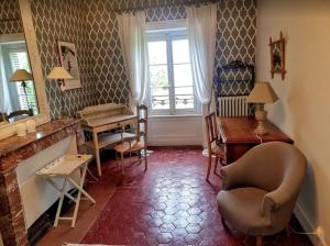 Posezení v ubytování Château des Charmes