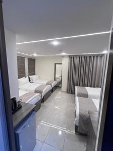 Postel nebo postele na pokoji v ubytování Golden Light Aqaba Hotel فندق جولدن لايت العقبة