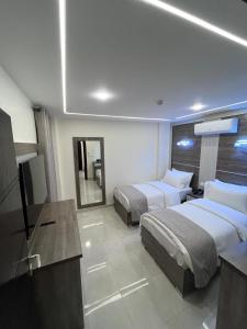 Postel nebo postele na pokoji v ubytování Golden Light Aqaba Hotel فندق جولدن لايت العقبة