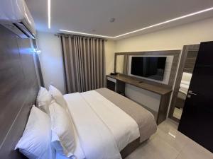 Postel nebo postele na pokoji v ubytování Golden Light Aqaba Hotel فندق جولدن لايت العقبة