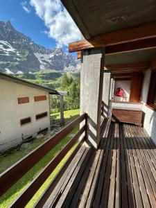 a balcony of a house with a view of mountains at Rododendro Ski-in Ski-out CIR 0491 in Breuil-Cervinia